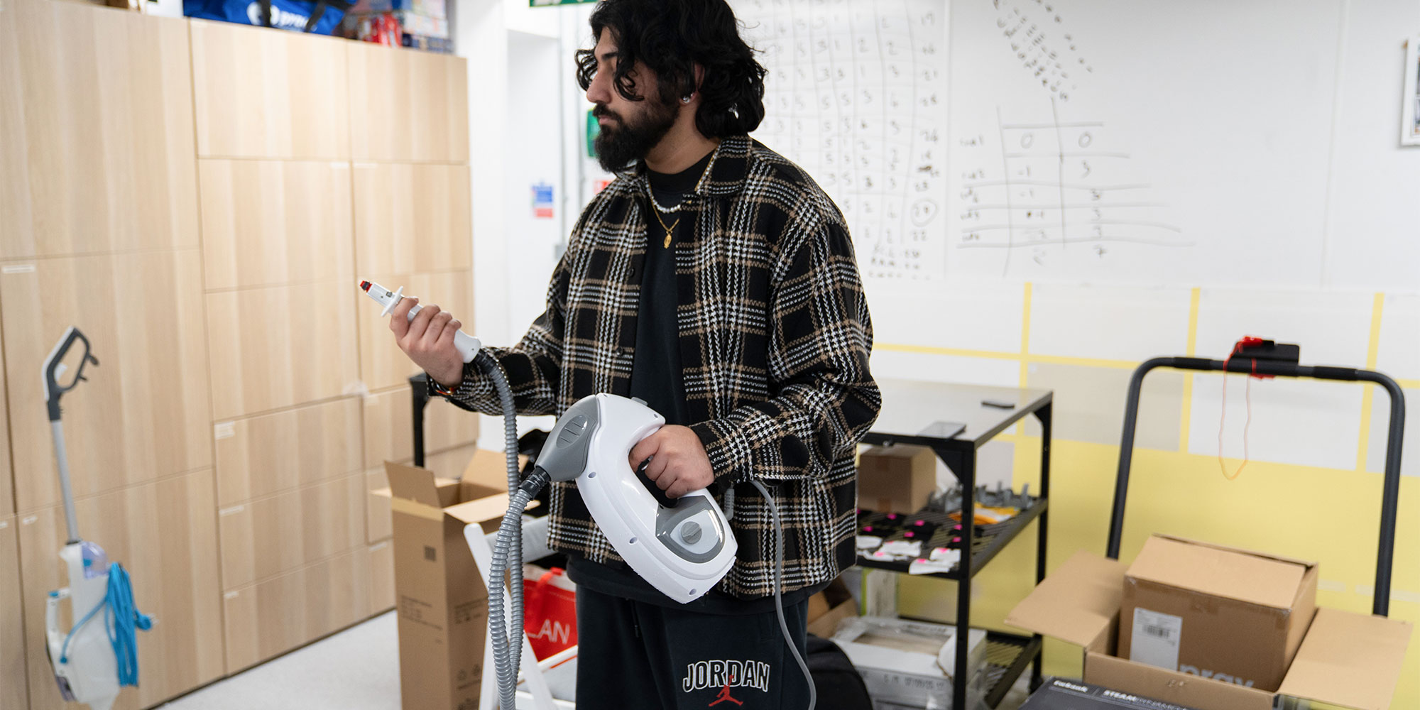 The tester assessing the ease of use of a steam cleaner.