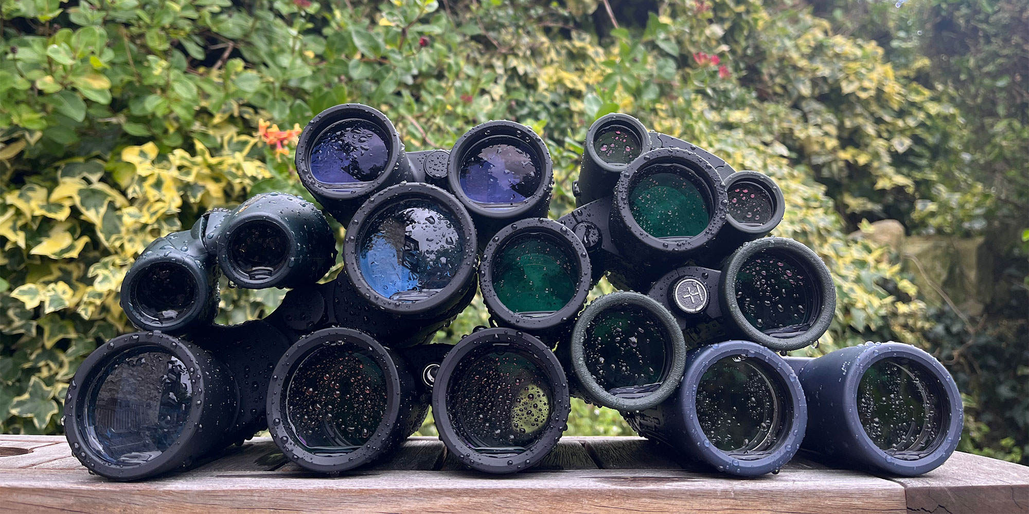 Binoculars piled up and covered with water from waterproofing testing