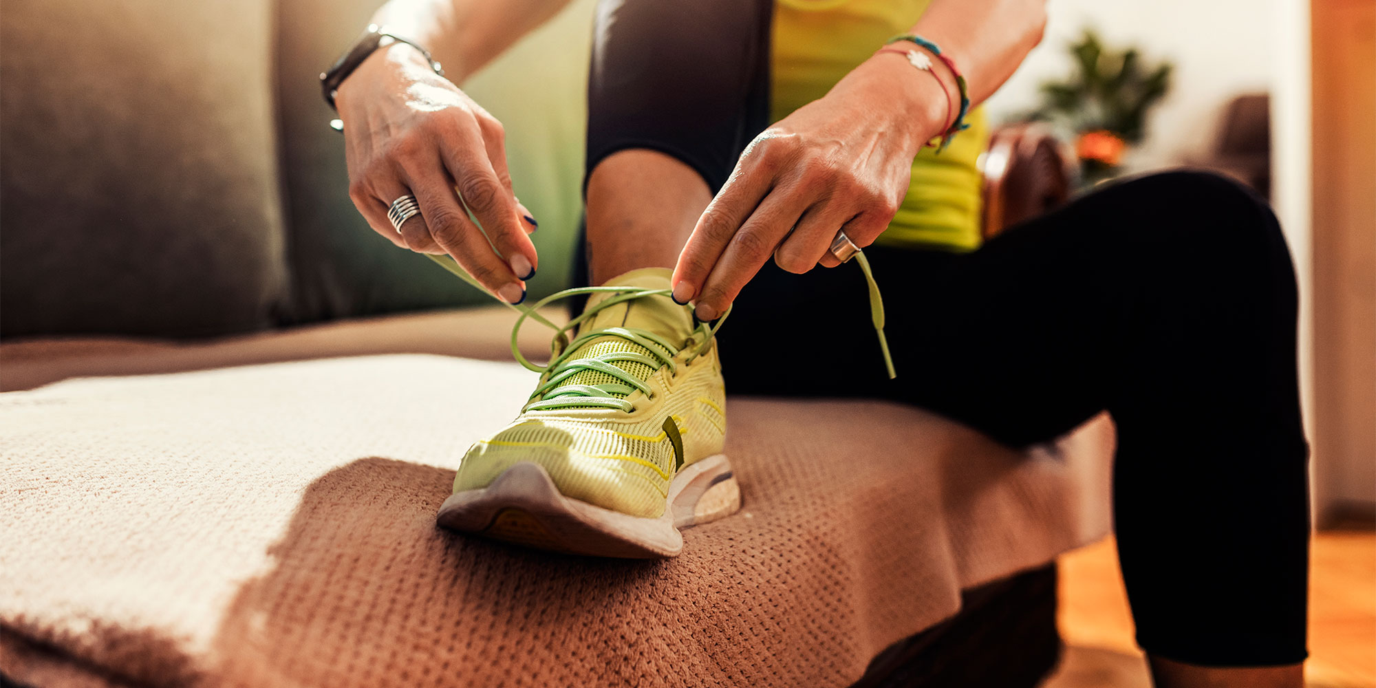 Tying up laces on a running shoe
