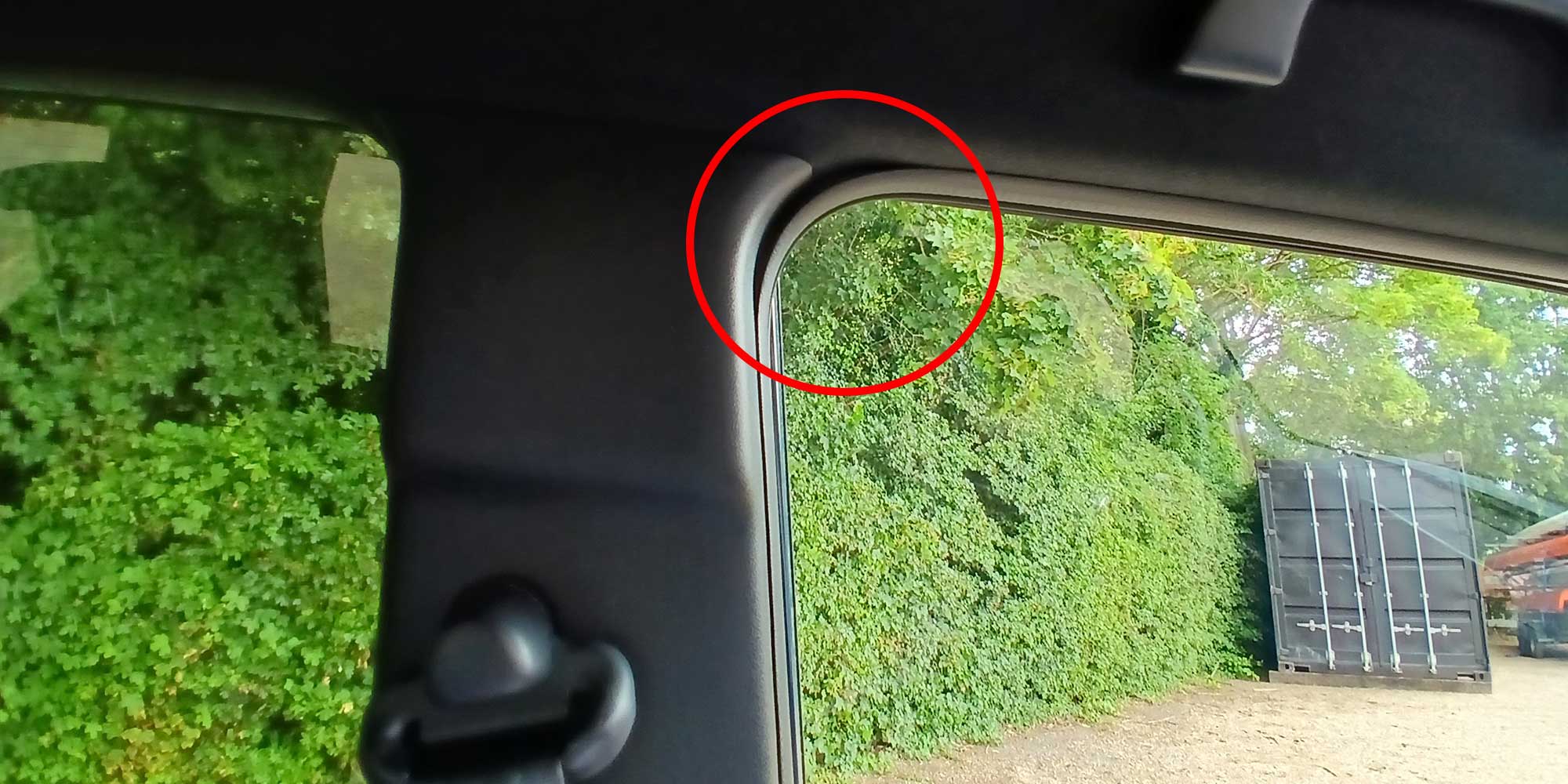 View from inside a Honda Super-N showing a misaligned door seal