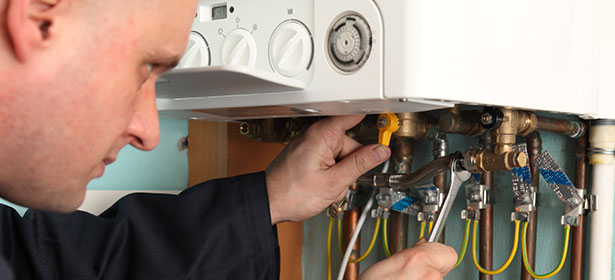 Boiler being serviced with spanner