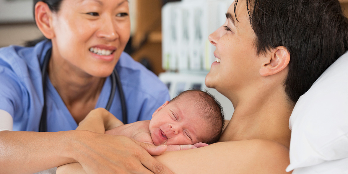 Mother and child with a midwife
