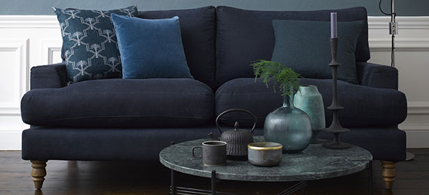 Navy sofa in blue living room