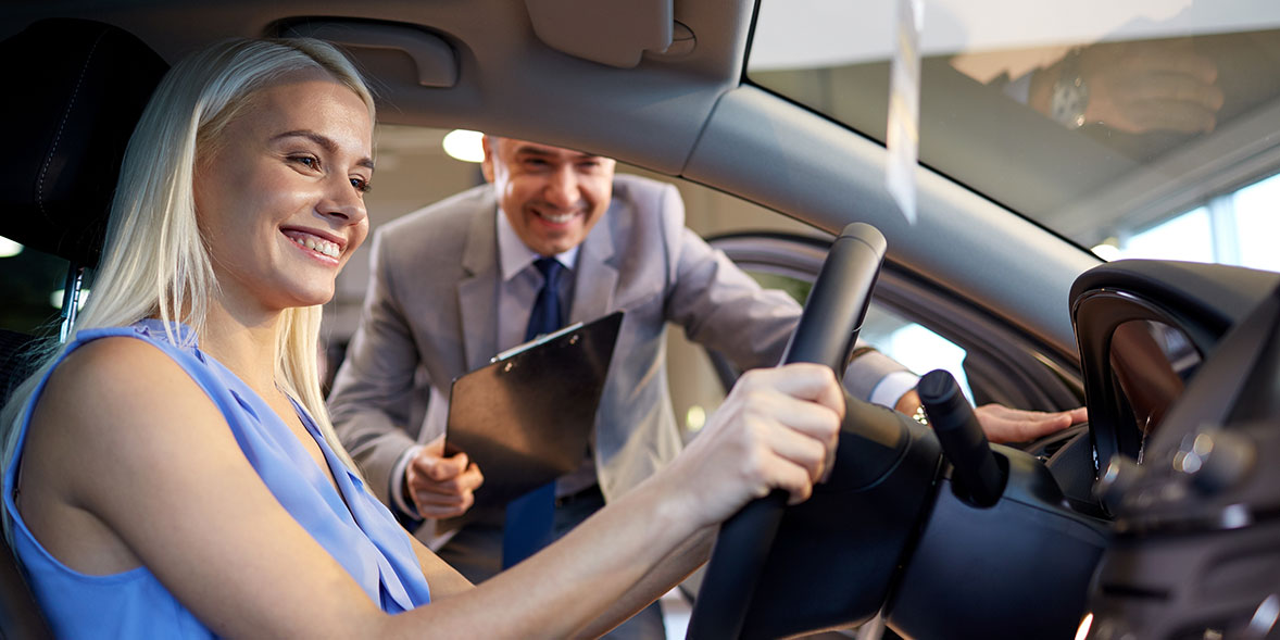 Woman test driving a car