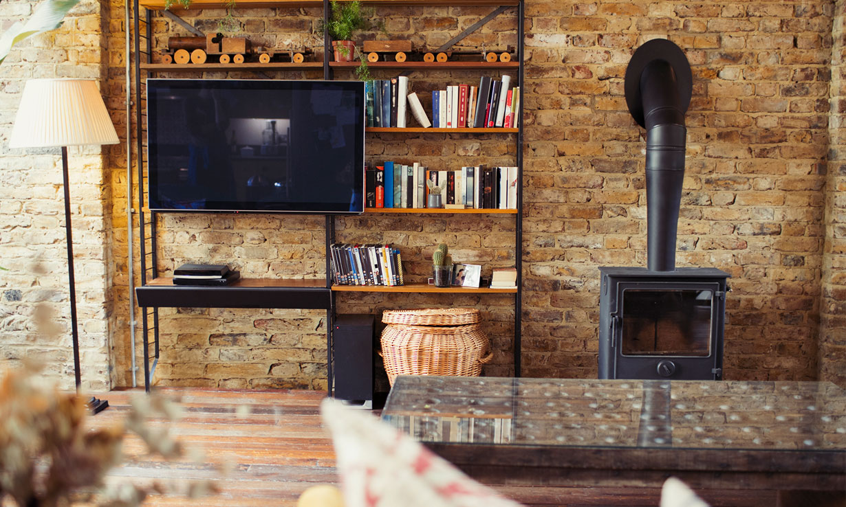 Wood-burning stove with flue going through brick w