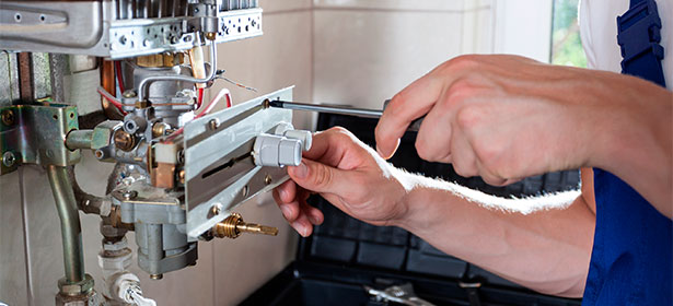 Boiler Engineer fixing a boiler