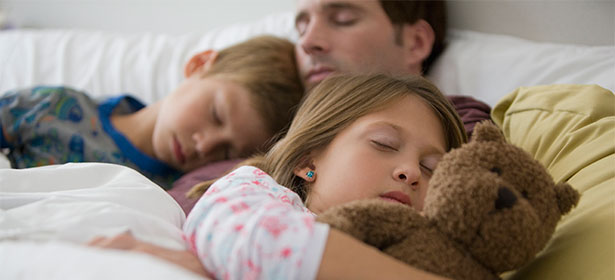 Family warm at home in bed 451062