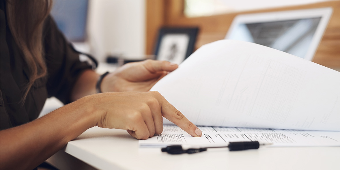 Person checking over paperwork