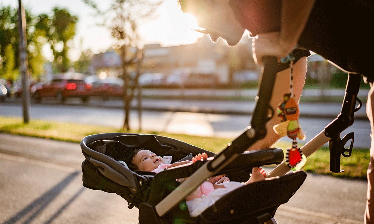 Parent looking at baby in pushchair in parent faci