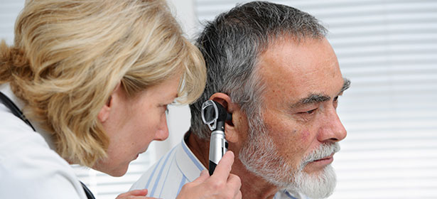 Doctor looking in ear 