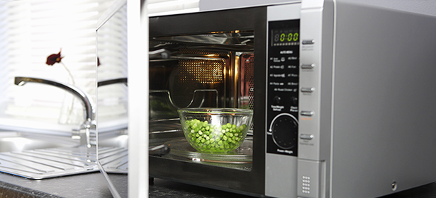 Peas cooking in a microwave
